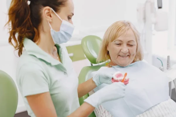senior_woman_having_dental_treatment_dentist_s_office_woman_is_being_treated_teeth_1
